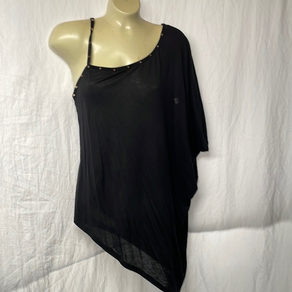 Black asymmetric, one shoulder top with gold studs.